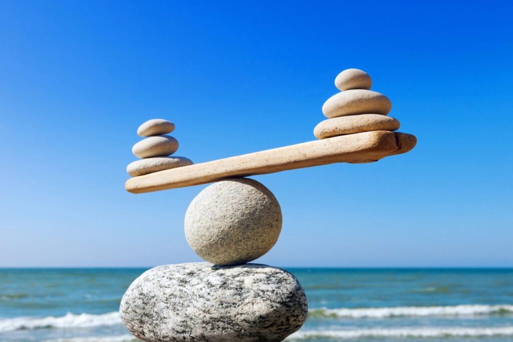 A balanced rock balancing on top of a stone.